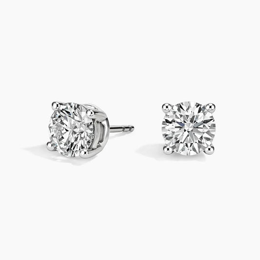 Round lab-grown diamond stud earrings in secure four-prong basket setting with Guardian backs